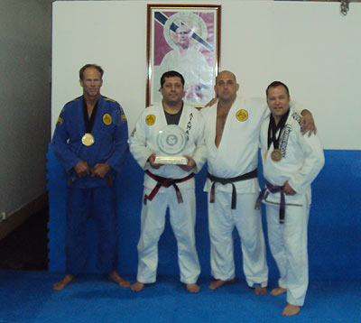 Charlie, Sean, Victor and Rolker Gracie with their gold medals and the 1st Place Team Trophy