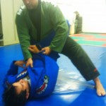 Step 2: Victor begins to stand. He's controlling Raphael's right sleeve so Victor begins to stand with his left leg.