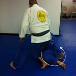 Victor loops his foot out of Robert's legs and starts to use knee pressure to start the pass.